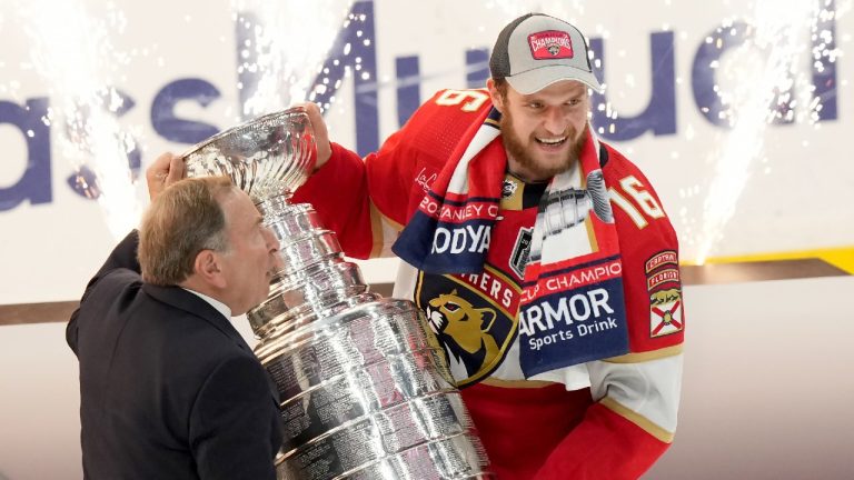 NHL commissioner Gary Bettman presents Florida Panthers forward Aleksander Barkov (16) with the Stanley Cup after winning the finals in Sunrise, Fla., on Monday, June 24, 2024. (Nathan Denette/CP)