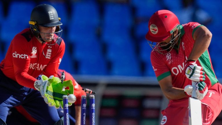 Oman's Fayyaz Butt is clean bowled by England's Adil Rashid for 2 runs during the T20 World Cup. Thursday, June 13, 2024. (AP Photo/Ricardo Mazalan)
