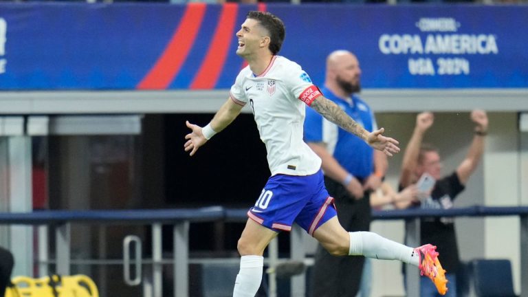 Christian Pulisic of the United States celebrates after scoring his side's opening goal against Bolivia during a Copa America Group C soccer match in Arlington, Texas, Sunday, June 23, 2024. (Julio Cortez/AP Photo)