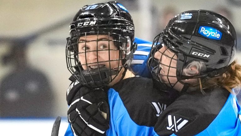 Toronto's Rebecca Leslie (left) celebrates with Alexa Vasko after scoring during a game against Montreal, March 8, 2024. (The Canadian Press/Chris Young)