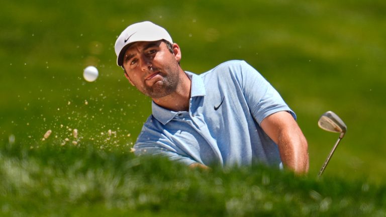 Scottie Scheffler hits from a bunker onto the fourth green during the final round of the Memorial golf tournament, Sunday, June 9, 2024, in Dublin, Ohio. (Sue Ogrocki/AP)