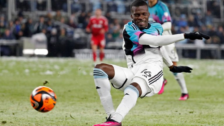 Minnesota United forward Tani Oluwaseyi kicks the ball at the goal against the New York Red Bulls in the second half of an MLS soccer game Saturday, March 11, 2023, in St. Paul, Minn. (AP Photo/Bruce Kluckhohn)