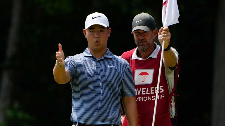 Tom Kim, of South Korea, lines up a putt on the 11th hole during the final round of the Travelers Championship golf tournament at TPC River Highlands, Sunday, June 23, 2024, in Cromwell, Conn. (Seth Wenig/AP)