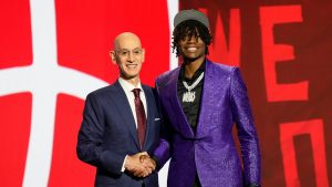 Ja'Kobe Walter poses for a photo with NBA commissioner Adam Silver after being selected 19th by the Toronto Raptors. (Julia Nikhinson/AP)
