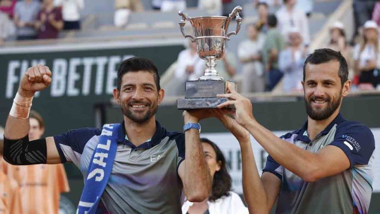 Marcelo Arevalo, of El Salvador, and Mate Pavic of Croatia celebrate with the trophy as they won the men's doubles final match of the French Open tennis tournament against Italy's Simone Bolelli and Andrea Vavassori at the Roland Garros stadium in Paris, France, Saturday, June 8, 2024. (Jean-Francois Badias/AP)