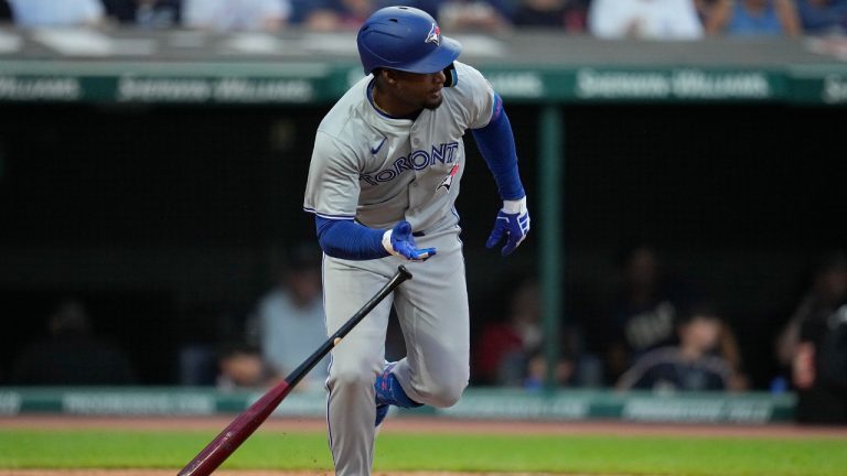 Toronto Blue Jays' Orelvis Martinez drops his bat and runs to first base with his first hit in the majors, during the sixth inning of the team's baseball game against the Cleveland Guardians, Friday, June 21, 2024, in Cleveland. (Sue Ogrocki/AP)