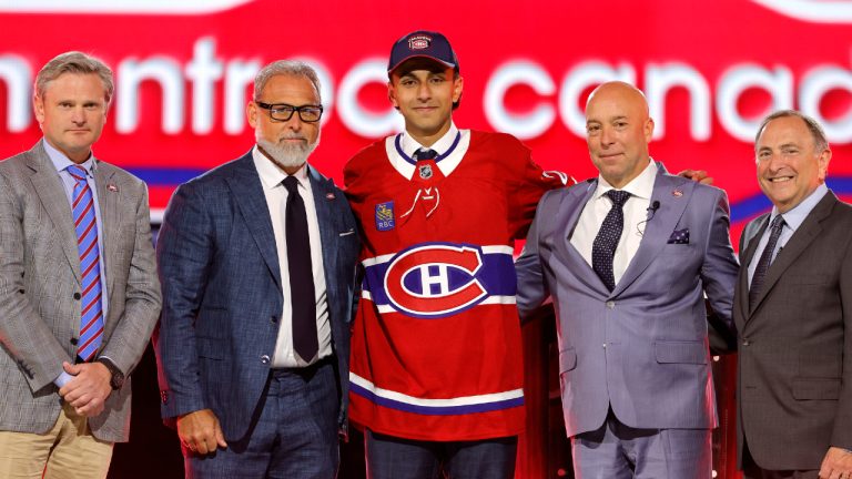 Michael Hage, center, poses after being selected by the Montreal Canadiens during the first round of the NHL hockey draft Friday, June 28, 2024, in Las Vegas. (Steve Marcus/AP)