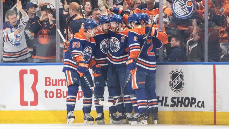Edmonton Oilers' Ryan Nugent-Hopkins (93), Zach Hyman (18), Connor McDavid (97) and Evan Bouchard (2) celebrate a goal against the Dallas Stars during first period action in game 6 of the Western Conference finals of the NHL Stanley Cup playoffs. (Jason Franson/THE CANADIAN PRESS)
