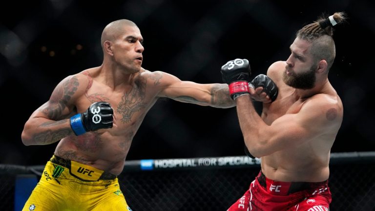 Brazil's Alex Pereira, left, punches Czech Republic's Jiri Prochazka during the second round of a light heavyweight title bout at the UFC 295 mixed martial arts event, early Nov. 12, 2023, in New York. (Frank Franklin II/AP Photo)