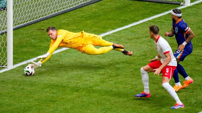 Poland's goalkeeper Wojciech Szczesny makes a save during a Group D match between Poland and the Netherlands at the Euro 2024 soccer tournament in Hamburg, Germany. (Petr Josek/AP)