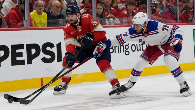 Florida Panthers centre Sam Reinhart (13) and New York Rangers defenceman K'Andre Miller (79) go for the puck during the second period of Game 6 in the Eastern Conference finals of the NHL hockey Stanley Cup playoffs Saturday, June 1, 2024, in Sunrise, Fla. (Lynne Sladky/AP)