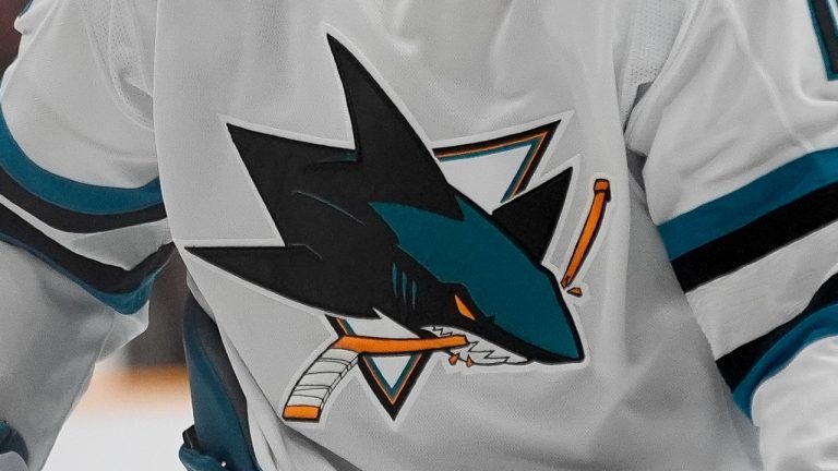 The San Jose Sharks logo is shown on a jersey. (George Walker IV/AP)