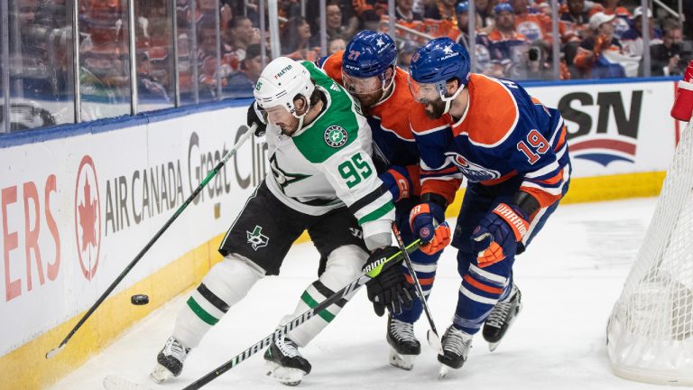 Dallas Stars' Matt Duchene (95) battles for the puck with Edmonton Oilers' Brett Kulak (27) and Adam Henrique (19) during first period action in game 6 of the Western Conference finals of the NHL Stanley Cup playoffs in Edmonton on Sunday June 2, 2024. (Jason Franson/CP)
