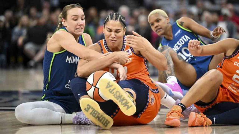 Minnesota Lynx centre Alanna Smith (8) and Connecticut Sun centre Brionna Jones (42) battle for a loose ball during the first half of a WNBA basketball game, Thursday, July 4, 2024 in Minneapolis. (Aaron Lavinsky/Star Tribune via AP)