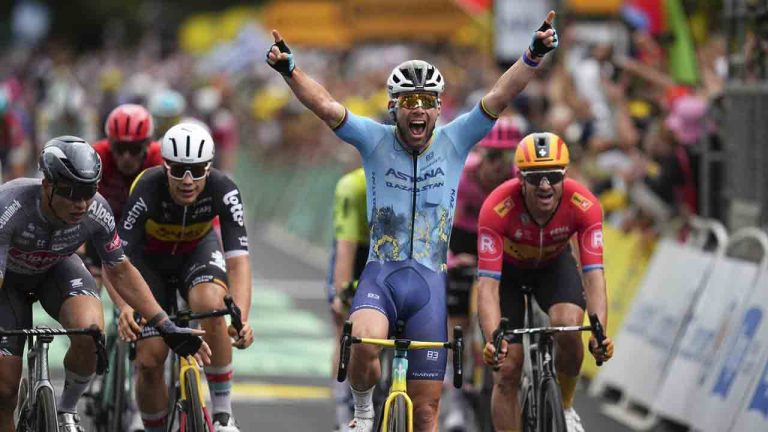 Britain's sprinter Mark Cavendish crosses the finish line for a record 35th Tour de France stage win, breaking the record of Belgian legend Eddy Merckx, in the fifth stage of the Tour de France cycling race over 177.4 kilometers (110.2 miles) with start in Saint-Jean-de-Maurienne and finish in Saint-Vulbas, France, Wednesday, July 3, 2024. (Daniel Cole/AP)