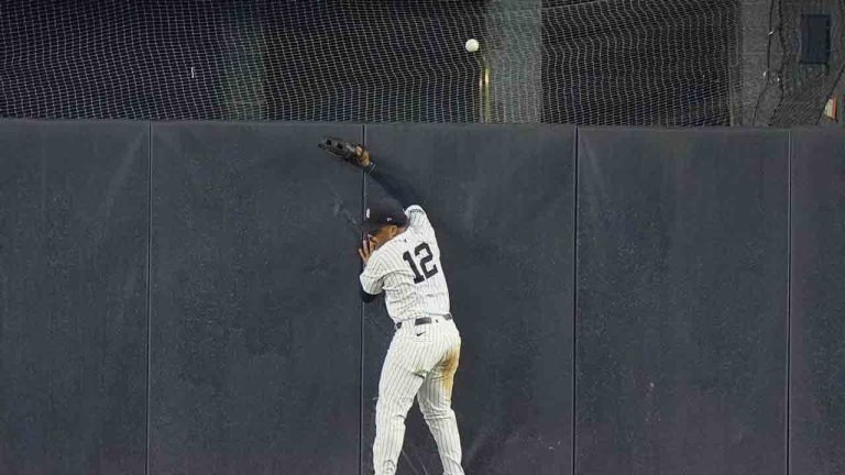 New York Yankees' Trent Grisham (12) chases a two-run home run hit by Boston Red Sox's Ceddanne Rafaela during the 10th inning of a baseball game, Friday, July 5, 2024, in New York. (Frank Franklin II/AP)