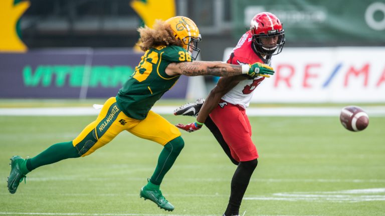 Calgary Stampeders' Kamar Jorden (88) looks for the pass under pressure from Edmonton Elks' Aaron Grymes (36) during first half CFL action in Edmonton, Alta., on Saturday September 11, 2021. The Elks released Grymes on Thursday. (Amber Bracken/CP)
