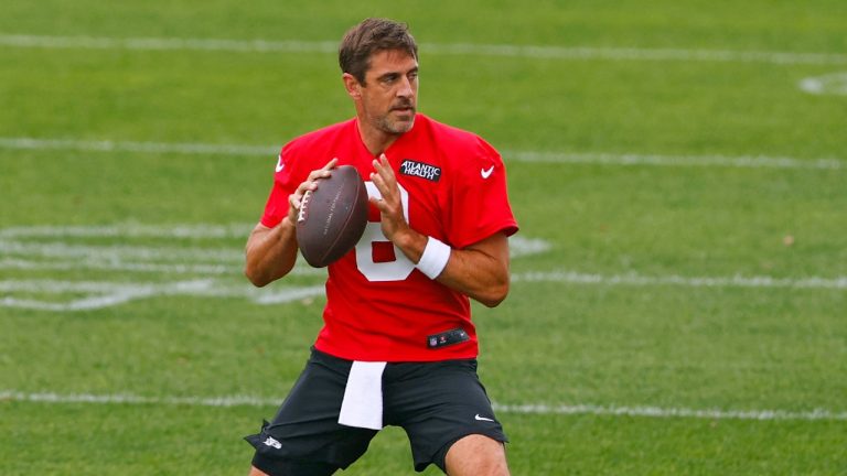 New York Jets quarterback Aaron Rodgers drops back to throw during the team's NFL training camp, July 24, 2024. (AP Photo/Rich Schultz)