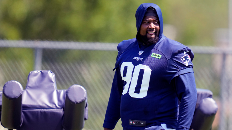 New England Patriots defensive tackle Christian Barmore (90) watches his teammates practice during an NFL football training camp, Friday, July 26, 2024, in Foxborough, Mass. (Charles Krupa/AP)