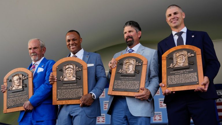 Baseball Hall of Fame inductees, from left, Jim Leyland, Adrián Beltré, Todd Helton and Joe Mauer hold their plaques at the National Baseball Hall of Fame induction ceremony, Sunday, July 21, 2024, in Cooperstown, N.Y. (Julia Nikhinson/AP)