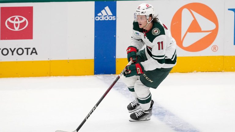 Minnesota Wild left wing Adam Beckman controls the puck during a preseason NHL hockey game against the Dallas Stars, Tuesday, Sept. 26, 2023, in Dallas. (Tony Gutierrez/AP Photo)