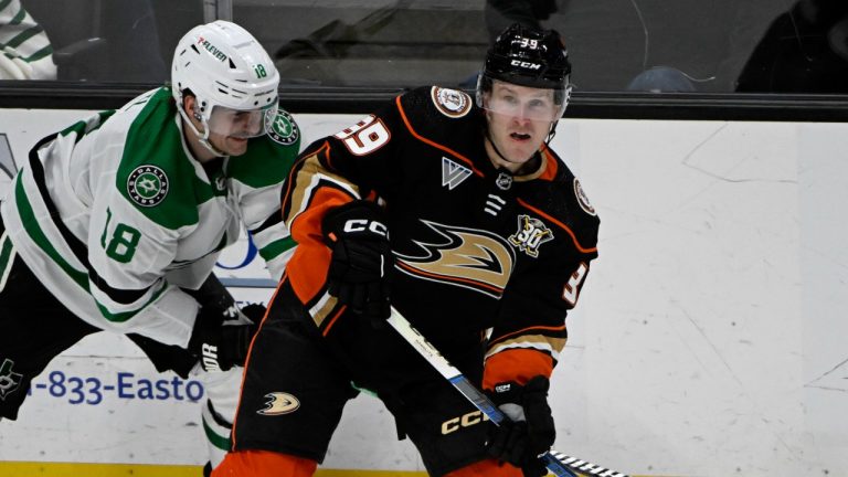 Anaheim Ducks' Ben Meyers passes the puck with Dallas Stars' Sam Steel defending during the third period of an NHL game, March 8, 2024. (AP Photo/Alex Gallardo)