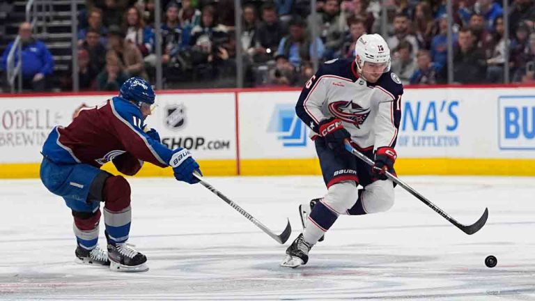 Columbus Blue Jackets center Brendan Gaunce (16) drives past Colorado Avalanche center Andrew Cogliano (11) in the second period of an NHL hockey game Friday, March 22, 2024, in Denver. (David Zalubowski/AP)