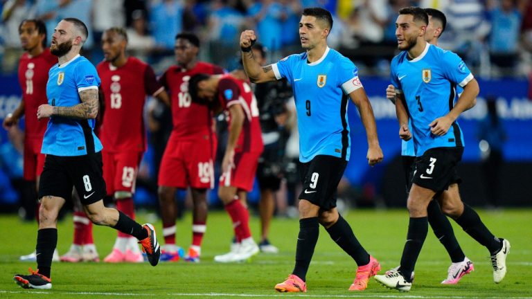 Uruguay's Luis Suarez (9), and teammates celebrate after defeating Canada in a penalty shootout during the Copa America third place soccer match. (Jacob Kupferman/AP)