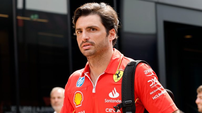 Ferrari driver Carlos Sainz of Spain arrives in the paddock ahead of the Formula One Grand Prix at the Spa-Francorchamps racetrack in Spa, Belgium, July 25, 2024. (AP Photo/Geert Vanden Wijngaert)
