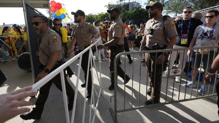 Policemen patrol the area as fans wait to enter at stadium prior to the Copa America final soccer match between Argentina and Colombia Sunday, July 14, 2024, in Miami Gardens, Fla. (Lynne Sladky/AP)