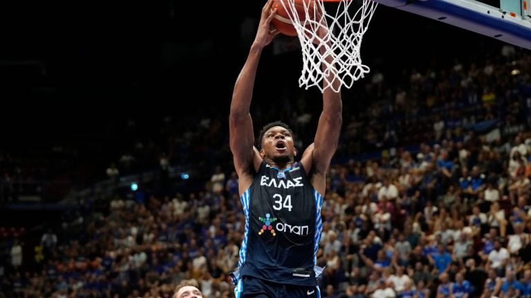 Greece's Giannis Antetokounmpo scores a basket during the Eurobasket group C basketball match between Estonia and Greece, in Milan, Italy, Thursday, Sept. 8, 2022. (Antonio Calanni/AP Photo)