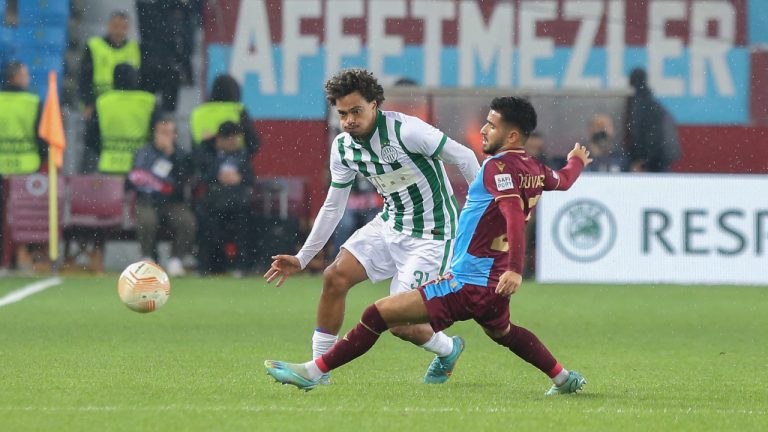 Ferencvaros' Henry Wingo, left, vies for the ball with Trabzonspor's Naci Unuvar during the Europa League group H soccer match between Trabzonspor and Ferencvaros at the Senol Gunes stadium in Trabzon, Turkey, Thursday, Nov. 3, 2022. Trabzonspor won 1-0. (AP Photo)
