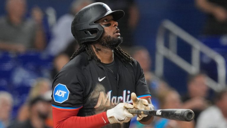 Miami Marlins' Josh Bell watches as he hits a home run to centre field during a game against the Seattle Mariners, June 21, 2024. (AP Photo/Marta Lavandier)