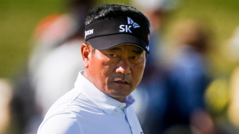 K.J. Choi talks to his caddie on the 18th hole during the second round of the Dominion Energy Charity Classic tournament, Oct. 22, 2022. (Shaban Athuman/Richmond Times-Dispatch via AP)