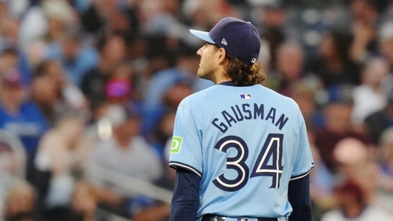 Toronto Blue Jays pitcher Kevin Gausman walks back to the dugout during a game against the Cleveland Guardians, June 14, 2024. THE CANADIAN PRESS/Chris Young