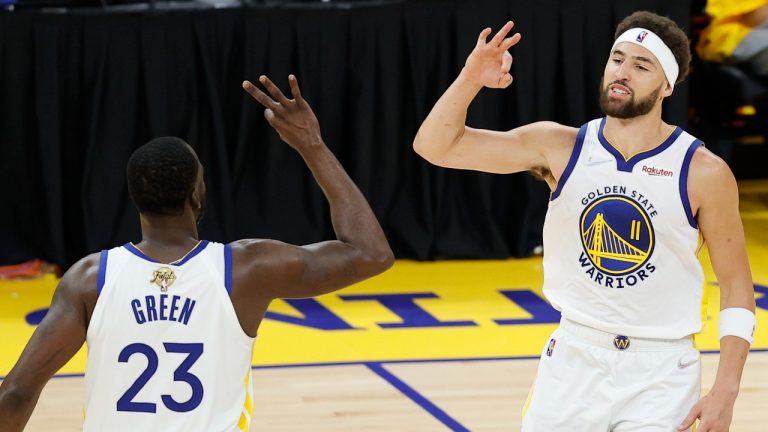 Golden State Warriors' Klay Thompson celebrates with forward Draymond Green during the second half of Game 1 of the NBA Finals against the Boston Celtics, June 5, 2022. (AP Photo/John Hefti)