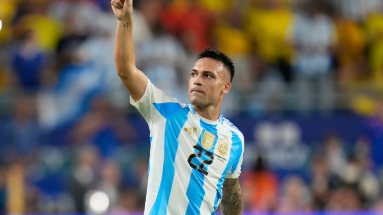 Argentina's Lautaro Martínez celebrates scoring his side's opening goal against Colombia during the Copa America final soccer match in Miami Gardens, Fla., Sunday, July 14, 2024. (AP/Julio Cortez)