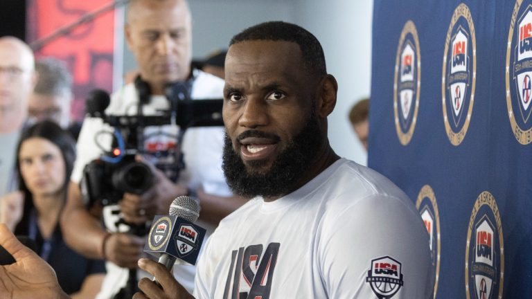 LeBron James of the Los Angeles Lakers responds to a question from a reporter during training camp for the United States men's basketball team Saturday, July 6, 2024, in Las Vegas. (AP Photo/Steve Marcus)