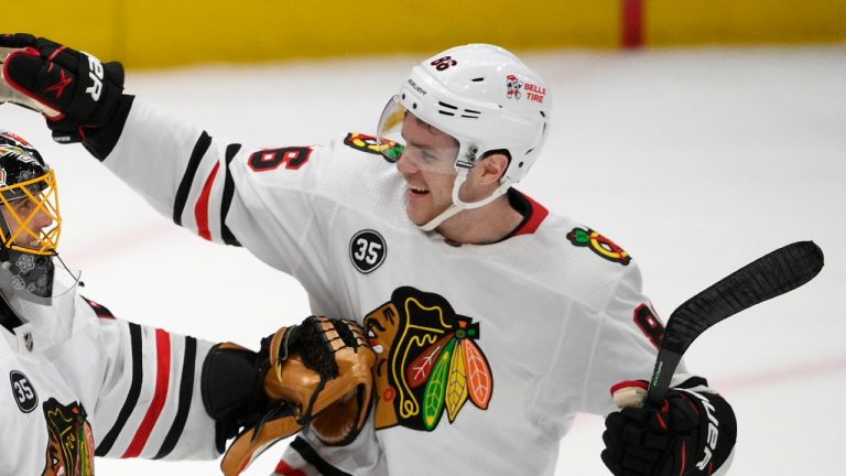 Chicago Blackhawks goaltender Marc-Andre Fleury celebrates with forward Mike Hardman after a team win against the Washington Capitals,, Dec. 2, 2021. (AP Photo/Nick Wass)
