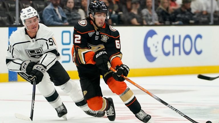 Anaheim Ducks center Nikita Nesterenko, right, controls the puck as Los Angeles Kings left winger Mikhail Maltsev chases. (Ryan Sun/AP)