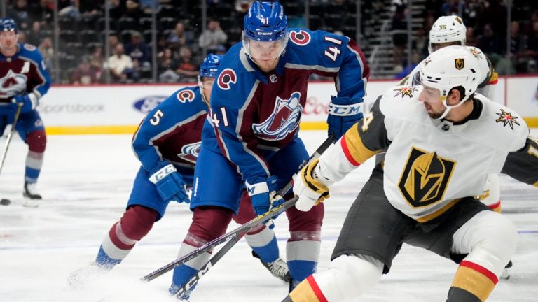 Vegas Golden Knights defenceman Nicolas Hague, right, knocks the puck away from Colorado Avalanche centre Jason Polin (41) in the first period of a preseason NHL hockey game. (David Zalubowski/AP)