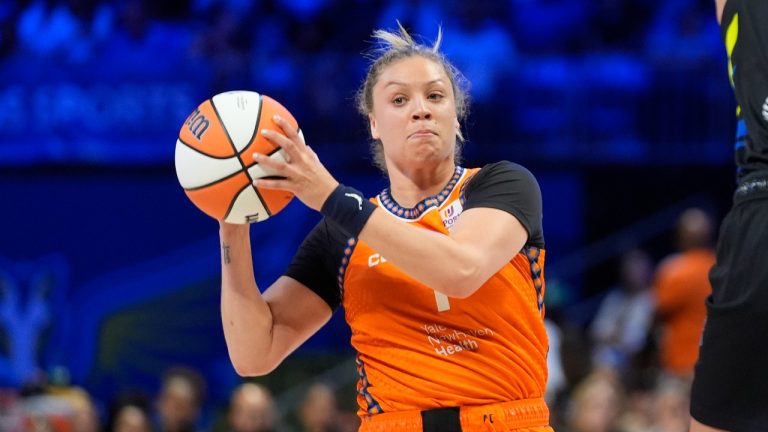 Connecticut Sun guard Rachel Banham looks to pass as Dallas Wings centre Stephanie Soares closes out during a WNBA game in Arlington, Texas, June 15, 2024. (AP Photo/LM Otero)