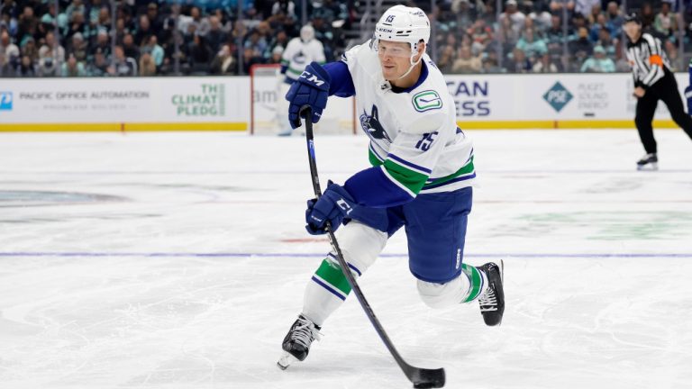 Vancouver Canucks center Sheldon Dries shoots against the Seattle Kraken during the second period of a preseason NHL hockey game Thursday, Sept. 28, 2023, in Seattle. (AP Photo/John Froschauer)