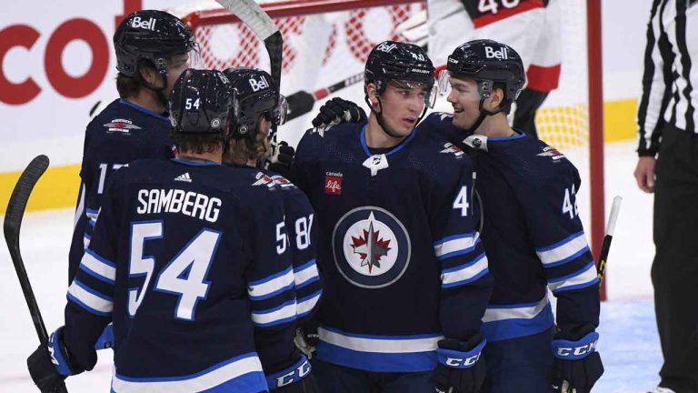 Winnipeg Jets' Daniel Torgersson (40) celebrates his goal against the Ottawa Senators with Simon Lundmark (42) and Dylan Samberg (54) during the first period of NHL pre-season action in Winnipeg. (Fred Greenslade/THE CANADIAN PRESS)