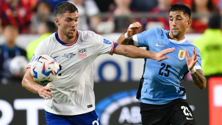 Joe Scally of the United States, left, and Uruguay's Cristian Olivera battle for the ball during a Copa America Group C soccer match in Kansas City, Mo., Monday, July 1, 2024. (Reed Hoffman/AP)