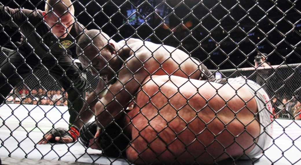 Jon-Jones,-top,-lands-an-elbow-during-one-of-his-UFC-title-defences