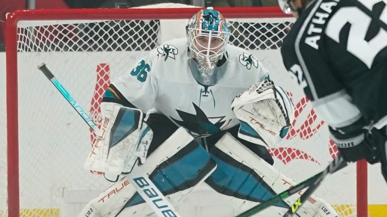 Los Angeles Kings Andreas Athanasiou (22) shoots against San Jose Sharks goaltender Zach Sawchenko during the first period of an NHL game Thursday, March 10, 2022, in Los Angeles. (AP Photo/Ashley Landis)