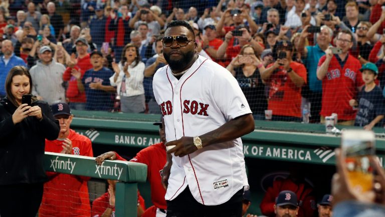 Former Boston Red Sox's David Ortiz comes onto the field to throw out a ceremonial first pitch before a baseball game against the New York Yankees in Boston, Monday, Sept. 9, 2019. (Michael Dwyer/AP)