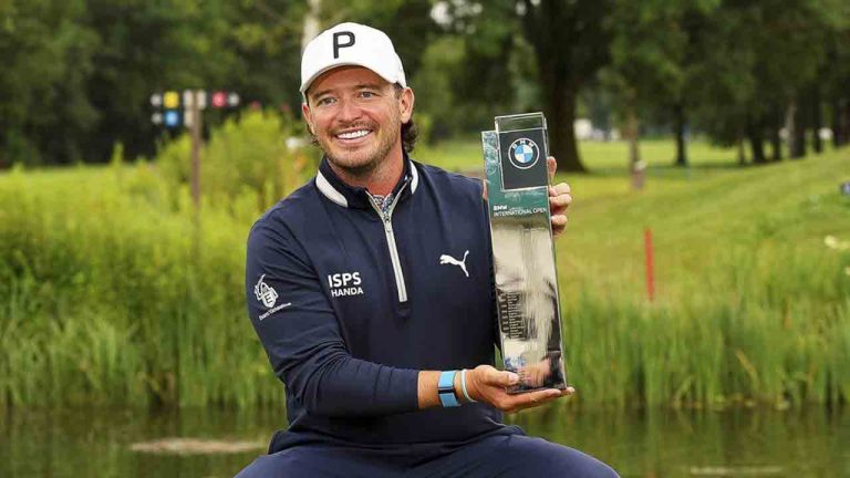 Scotland's Ewen Ferguson poses with the trophy after winning the BMW International Open Golf tournament in Munich/Eichenried, Germany, Sunday, July 7, 2024. (Christian Kolbert/kolbert-press/dpa via AP)