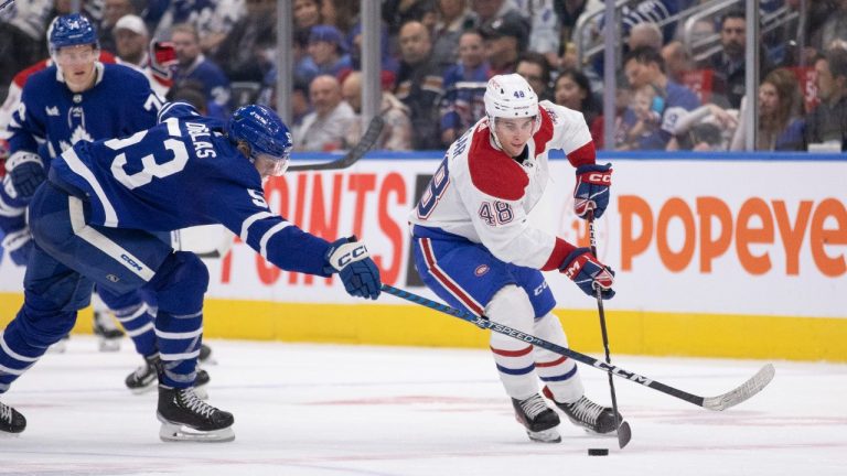 Curtis Douglas (53) of the Toronto Maple Leafs defends against Filip Mesar (48) of the Montreal Canadiens during second period NHL preseason action in Toronto on Wednesday, September 28, 2022. (Nick Iwanyshyn/CP)
